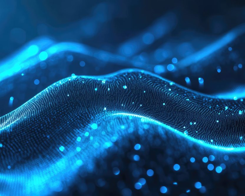 Abstract digital wave consisting of glowing blue particles creating a dynamic visual representation of data flow, network connectivity, and technological concepts